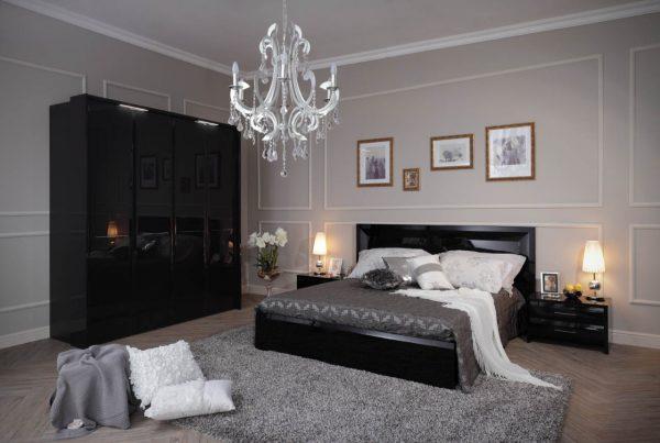 Спальня с чёрной мебелью и серыми стенами